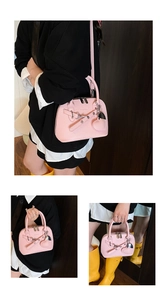 Pink lychee texture shell bag shown in crossbody and handheld styles with heart charm