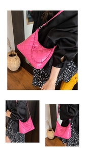 Close-up of bright pink quilted shoulder bag with chain detail and metallic twist lock