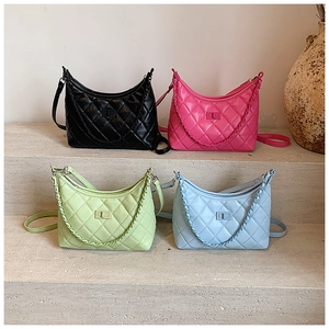 Quilted leather shoulder bags in black, pink, green, and blue with chain handles