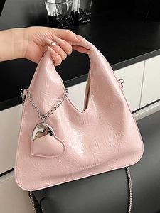 Pink triangle handbag with wrinkled patent leather and silver chain strap for women