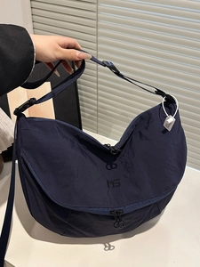 Versatile navy nylon tote bag with MS logo embroidery and adjustable black shoulder strap