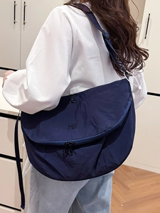 Versatile navy blue nylon crossbody tote bag with large capacity for daily urban commuting