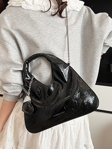 Minimalist black glossy pleated crescent handbag with silver chain strap for women