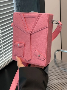 Pink box bag with suit-inspired design and silver studs in high-quality pebbled leather