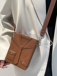 Unique brown suit-style box bag with lychee texture and creative tie-shaped detail