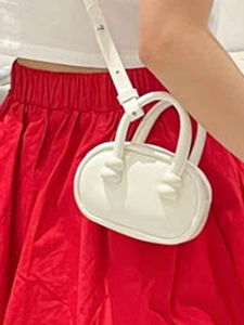 Minimalist white mini square bag with knot handle detail and adjustable shoulder strap