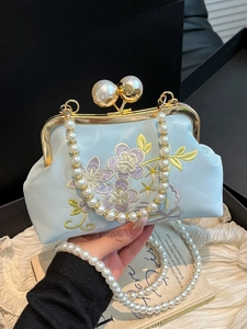 Elegant light blue embroidered evening bag with pearl clasp and dual chain straps