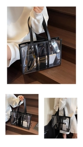 Macro shot of minimalist large transparent PVC tote bag with black leather trim and inner pouch