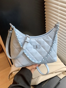 Light blue quilted leather crossbody bag with silver chain and twist lock detail