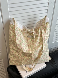 Floral cotton tote bag with delicate lace trim and sweet ribbon tie design