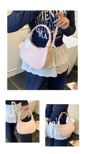 Detailed view of the smooth pink faux leather hobo bag with elegant gold metal hardware