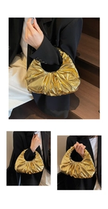 Three-way view of a gold pleated handbag on a wooden staircase showing stylish usage