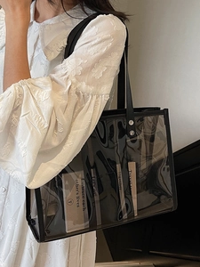Minimalist transparent PVC tote bag with black trim and motivational quote card insert