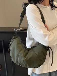 Minimalist army green crescent tote bag made of waterproof nylon for daily commute