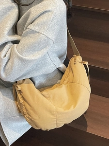 Minimalist light brown large tote bag with wide strap and drawstring for women