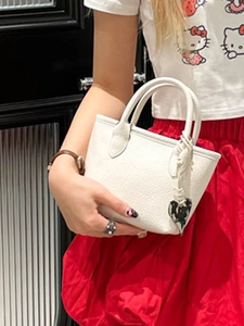 Minimalist white leather square tote bag with silver heart pendant and round handles