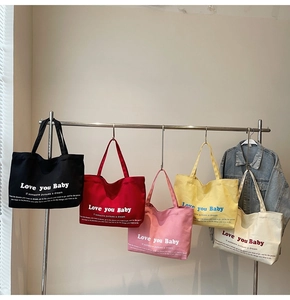 Detailed display of high-capacity canvas tote bags in five vibrant contrast colors