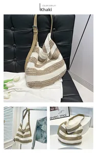 Detail shot of khaki striped hollow woven tote bag with adjustable leather strap