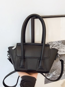 Classic black litchi pattern leather bucket bag with dual handles and long shoulder strap