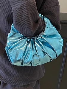 Chic metallic blue pleated handbag for women with a round hobo silhouette