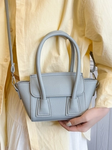 Pale blue lychee texture trapezoid handbag with long top handle and silver hardware