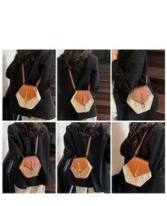 Detail view of woven hexagon straw bucket bag with leather strap on model's back