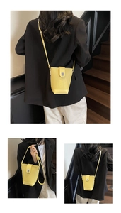 Detailed views of yellow bucket bag showing leather texture and silver twist lock closure