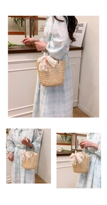 Detail view of woven straw bucket bag with floral lace bow and drawstring liner