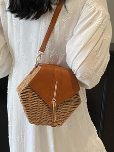 Chic hexagonal woven straw crossbody bag with brown faux leather flap and tassel accent