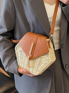 Chic hexagonal straw and leather patchwork crossbody bag with elegant fringe and metal detail