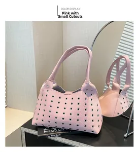 Pink rivet hollowed-out shoulder bag featuring textured lychee grain leather finish