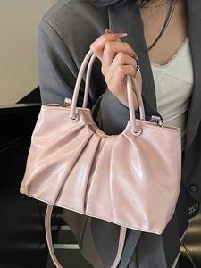 Pink pleated oil wax leather handbag with top handle and crossbody strap for women