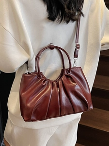 Dark red ruched oil wax leather handbag with top handles and adjustable shoulder strap