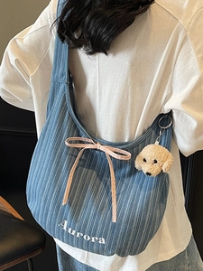 Blue and white striped corduroy tote bag with pink bow and cute dog keychain