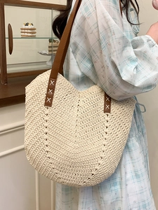Large cream woven straw tote bag with brown PU leather straps for summer beach travel