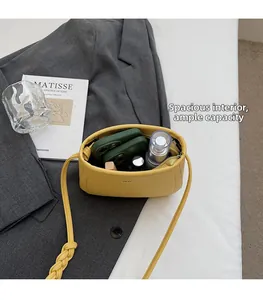 Interior view of yellow lychee leather crossbody bag showing daily essentials capacity