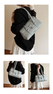 Detail of light blue pebble leather tote bag with silver twist lock and minimalist design