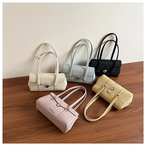 Flat lay of textured leather underarm bags in five colors with silver metal buckles