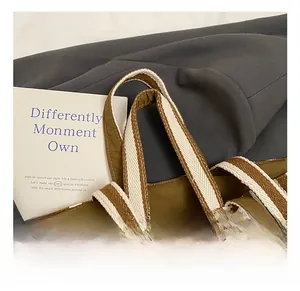 Detailed close-up of thickened woven canvas tote straps showing smooth stitching and texture