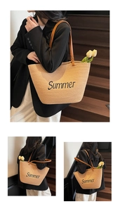 Detail of woven straw tote bag with Summer embroidery and brown leather shoulder straps