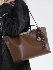 Large capacity dark brown faux leather tote bag with unique charm for summer 2025