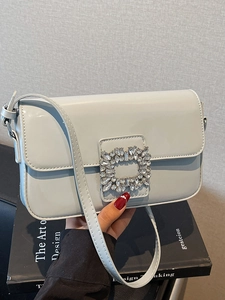 Light blue patent leather square crossbody bag with sparkling crystal buckle detail