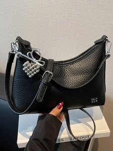 Fashionable black pebble leather half-moon shoulder bag with adjustable silver buckle