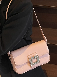Pink patent leather square bag with large rhinestone buckle and slim shoulder strap