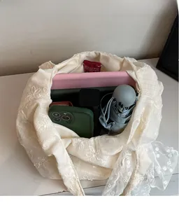 Spacious interior of beige lace floral tote bag showing storage for tablet and umbrella