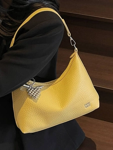 Chic yellow litchi leather square shoulder bag with heart charm and silver metal strap