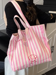 Pink striped canvas tote bag with cartoon dog print and wide shoulder strap