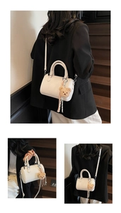 White lychee leather barrel bag with cute bear charm shown in multiple styling views