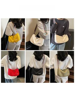 Collage of crescent canvas crossbody bags in six colors with striped wide straps
