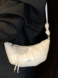 Minimalist cream white crescent dumpling bag with pleated leather and silver logo